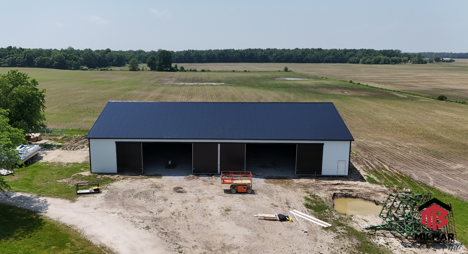 72x120x16 Ag Barn Storage Vehicle and Equipment Storage Post Frame Pole Barn by Milmar Buildings Front Bright White Shiny Black
