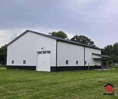 Black and White Post Frame Pole Barn/Garage by Milmar Buildings