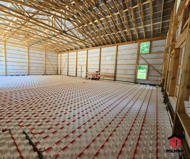Under Construction In Floor Heating in a Garage Post Frame Building by Milmar Buildings