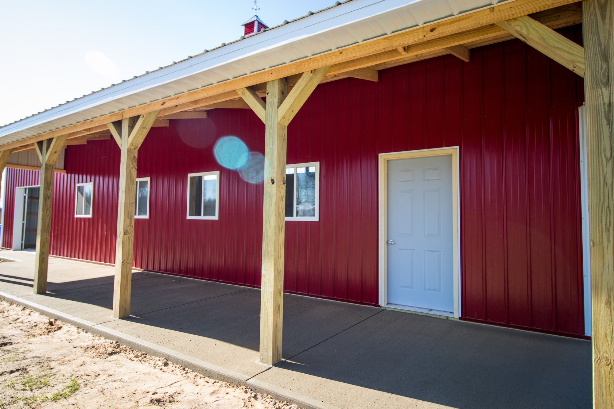 White & Red Pole Barn Front Porch